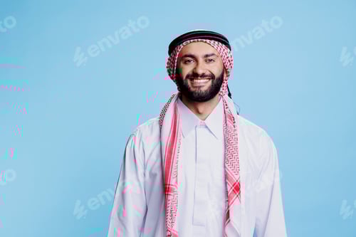 Preview: Smiling muslim man studio portrait