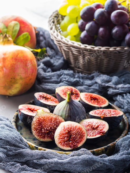 Preview: Dish of purple figs, grapes and pomegranate