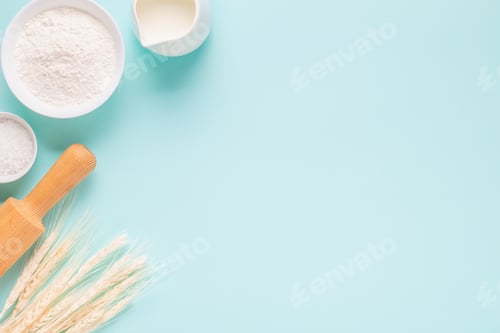 Preview: Ingredients for baking on light blue background.