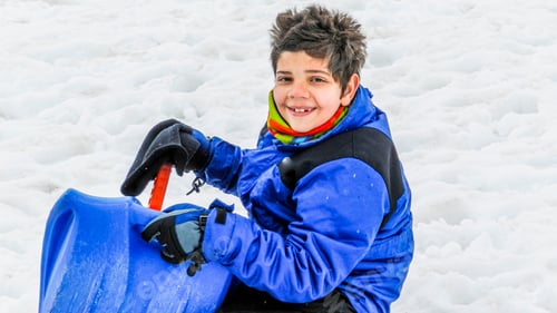 Preview: Happy kid having fun in the snow