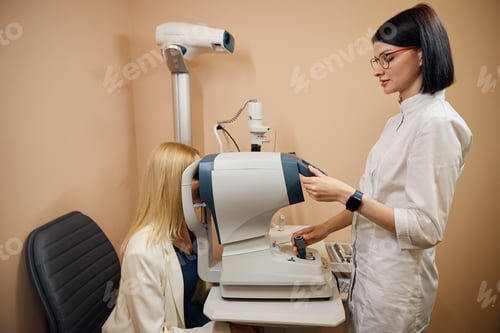 Preview: Young ophthalmologist examines the eyes of a patient