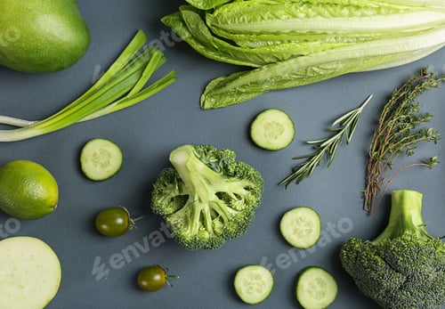 Preview: Different green vegetables and fruits on dark background, top view