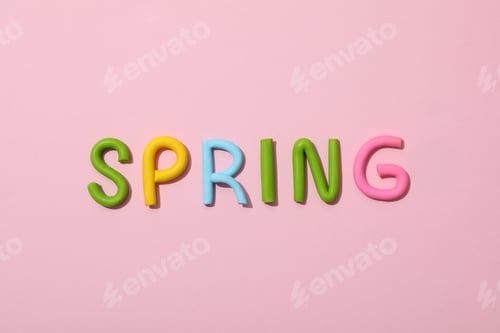 Preview: The word "spring" is made of colored plasticine, laid out on a pink background.