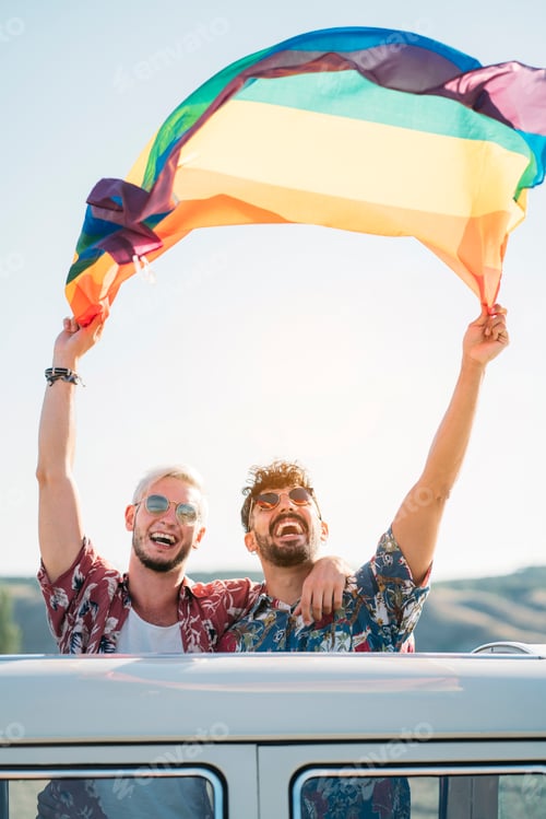 Preview: Gay couple in van holding LGBT flag
