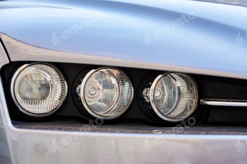 Preview: Headlight with halogen lamp on modern car, closeup