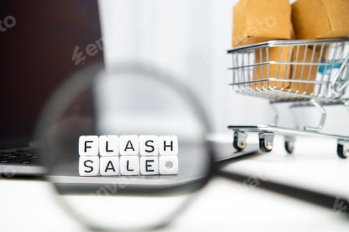 Preview: Through a magnifying glass, cubes with words Flash Sale can be seen.
