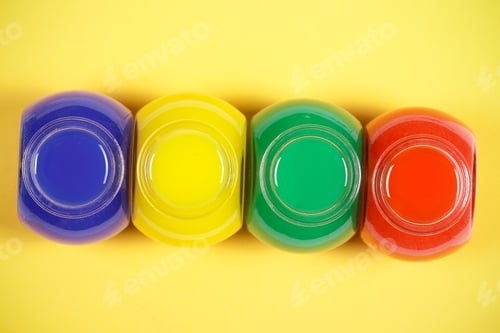 Preview: Jars With Bright Paint Are On The Table