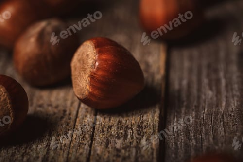 Preview: close up view of shelled hazelnuts on wooden tabletop