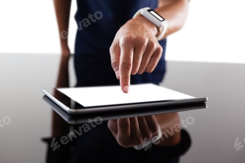 Preview: Businesswoman using digital tablet