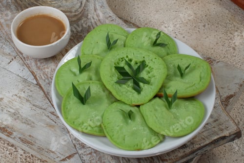 Preview: serabi or surabi - indonesian pancake,made from rice flour, coconut milk and served with brown sugar