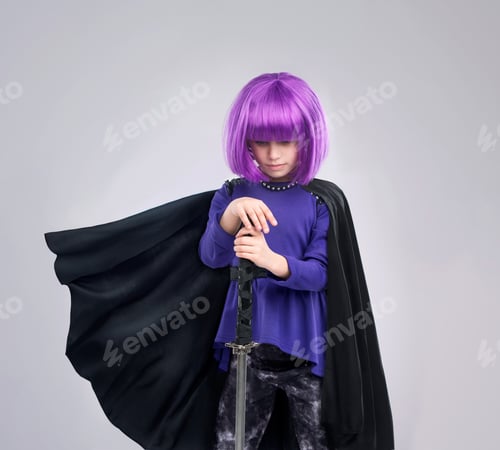 Preview: Dont be mistaken with her strength. A studio shot of a confident little girl playing dress-up.