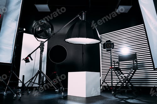 Preview: Modern photo studio with professional equipment. Black cyclorama.