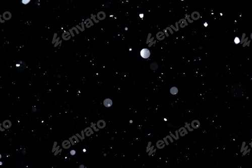 Preview: Element for winter design or overlay. Real snow over black background.