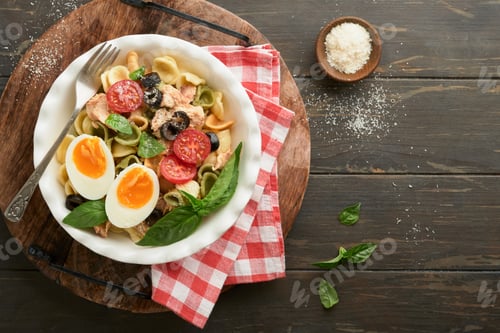 Preview: Italian pasta salad. Orecchiette pasta with tuna, tomato cherry, olive, basil and parmesan cheese in