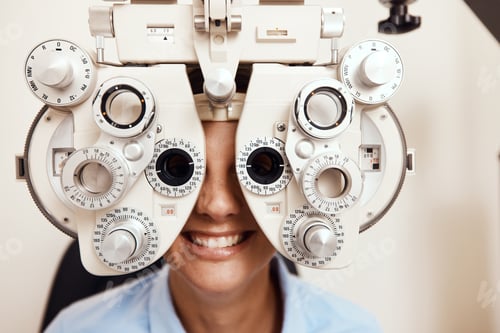 Preview: Shot of a young woman getting her eyes examined with an optical refractor