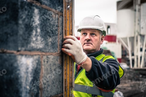 Preview: Workers laying bricks on construction site