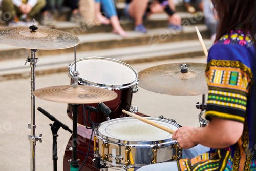 Preview: Drummer man playing drums percussion with drum sticks, drum set on concert stage, sticks and drums