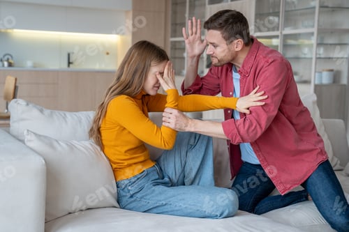 Preview: Tyrant husband holding female hand, ready to hit, beat. Abused woman protecting from aggressive male