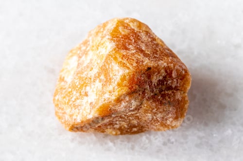 Preview: sample of raw heliolite sunstone mineral on white