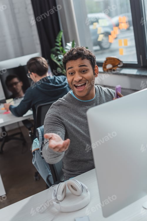 Preview: excited man reaching hand at modern office