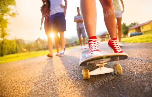 Preview: Young peoples legs with skateboard