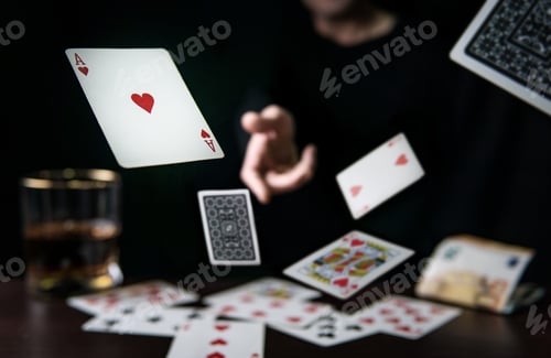 Preview: Man throwing playing poker cards, gambling concept