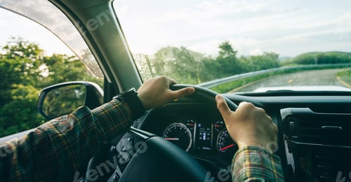 Preview: DrivingPeople driving car on sunrise mountain road