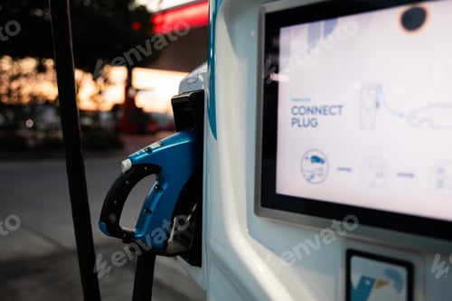 Preview: electric vehicle EV charging station night dusk blue charger cable handle display screen