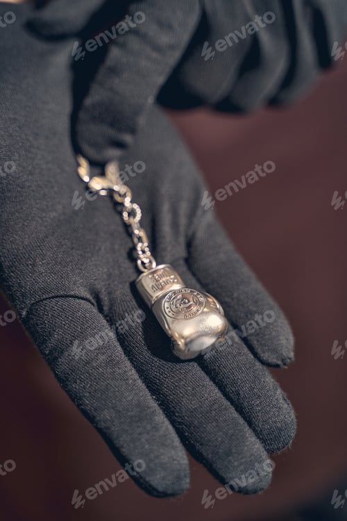 Preview: Silver charm lying on a jeweler palm