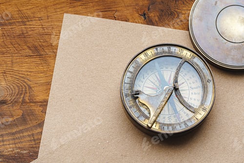 Preview: Vintage metal compass on carton paper close up