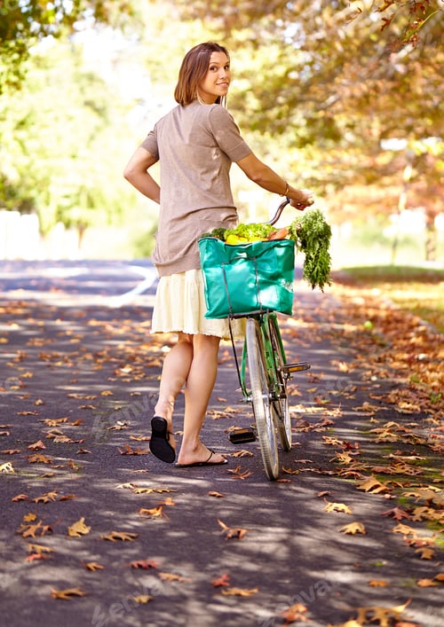 Preview: Autumn beauty. Shot of an attractive young woman in the park on an autumn day.