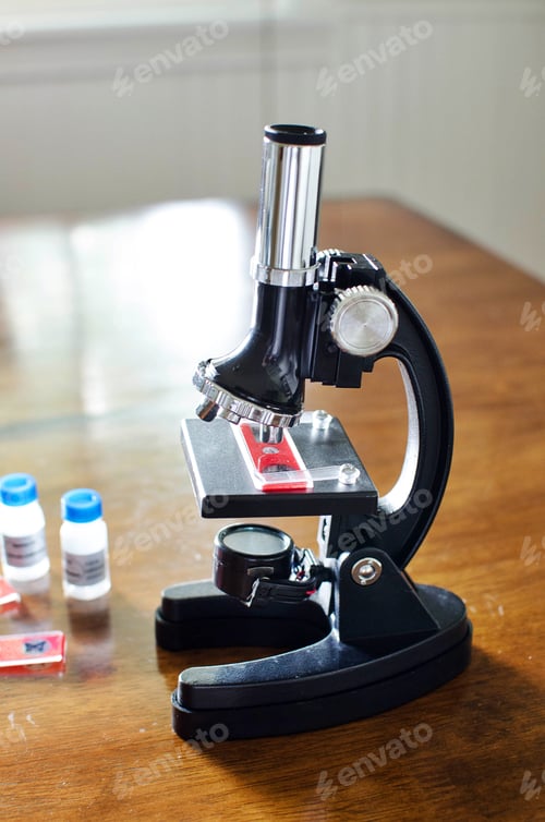 Preview: Science lesson at school with microscope and slides