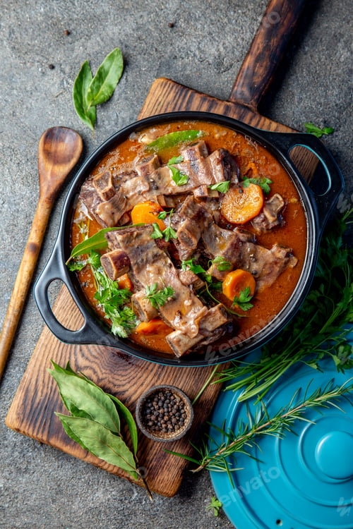 Preview: Beef ribs Bourguignon. Beef ribs stewed with carrot, onion in red wine. France dish. Top view