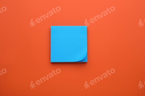 Preview: Paper note on orange background, top view