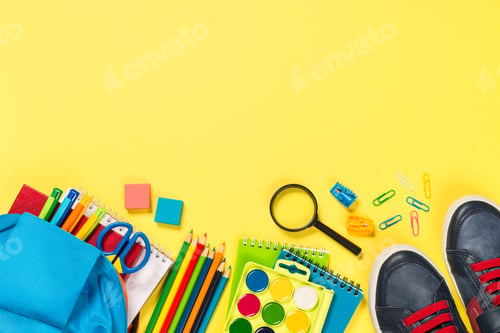 Preview: School backpack with stationery on yellow background