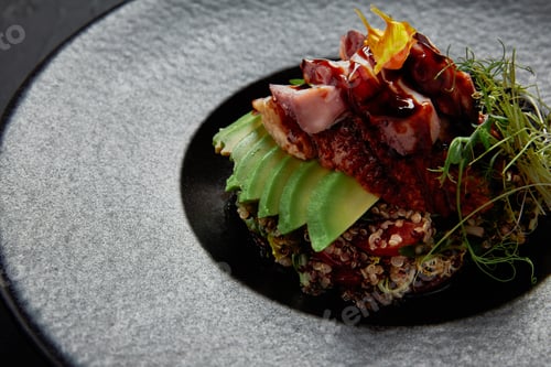 Preview: close-up view of Japanese Ceviche with seafood, avocado and herbs on black plate