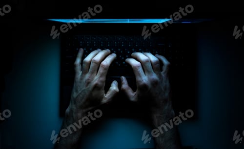 Preview: Top view of the hands of a programmer on his laptop