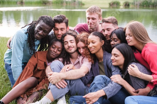 Preview: Group of friends doing relaxation exercises outdoors and sharing moments