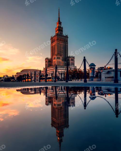 Preview: Palace of Culture and Science reflecting in the water at sunset in Warsaw, Poland.