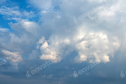 Preview: White and grey fluffy cloud on blue sky background texture. Heavy storm cumulus cloud. Copy space