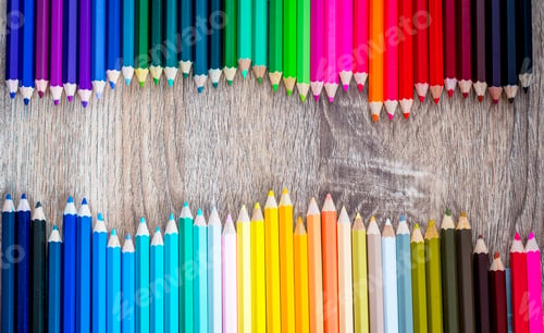 Preview: Multi Color pencils in scale with rainbow style isolated on wooden background