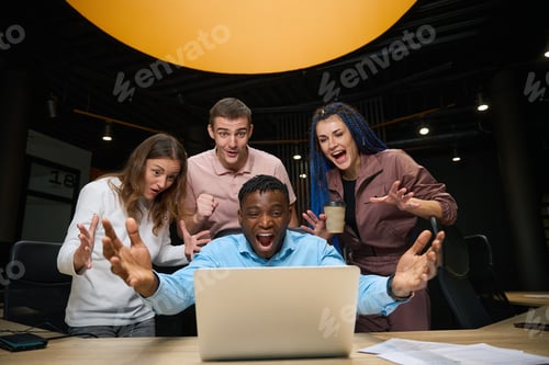 Preview: Extremely happy satisfied people looking at laptop display