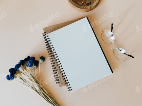 Preview: Flat lay blank paper sheet in notebook, dry flowers bouquet, glasses