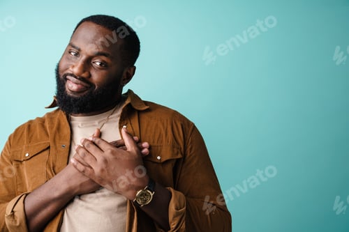 Preview: Happy african american man posing with hands on his chest