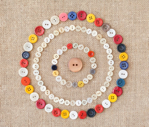 Preview: Circles of colorful sewing buttons.Background