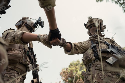 Preview: Special forces soldier in camouflage, fist bump and send energy to each other