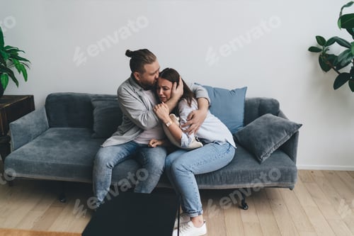 Preview: Loving man supporting unhappy young woman