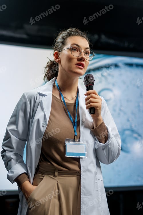 Preview: woman is giving a presentation at a conference