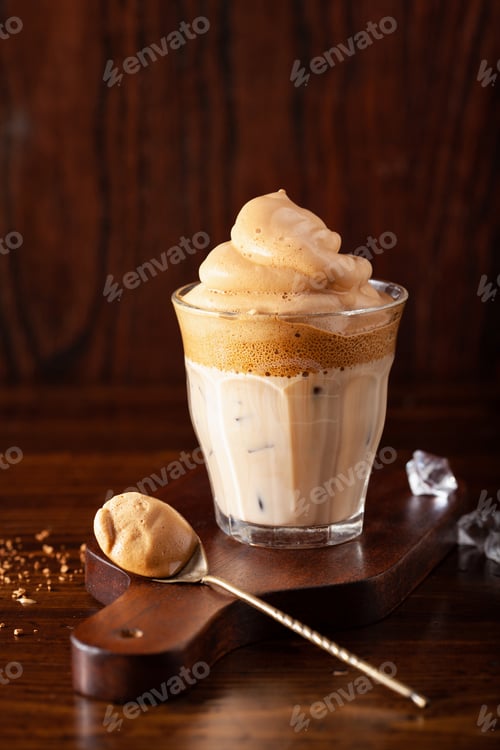 Preview: dalgona coffee in glass. trendy Instant coffee whipped with sugar and hot water