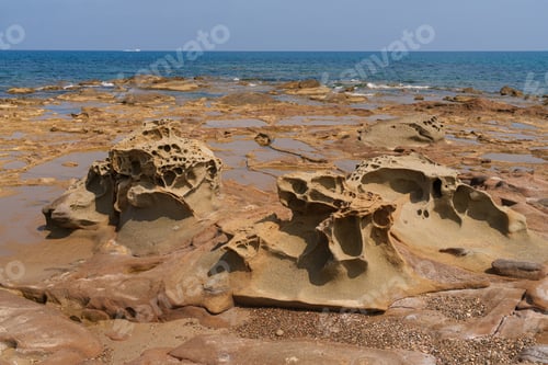 Preview: Eroded Coastal Rocks on a Sunny Shoreline